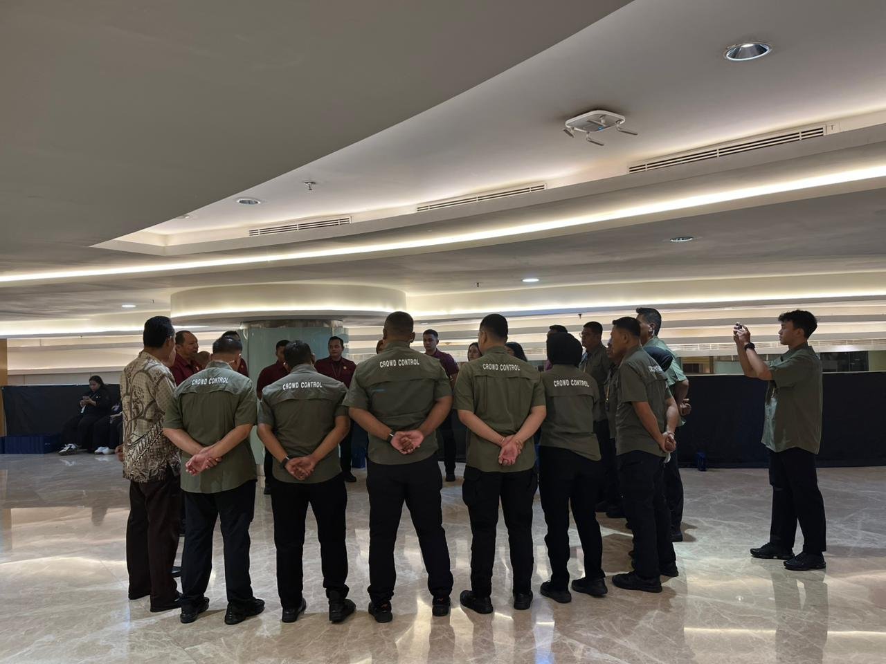 Crowd control team briefing before an event in the ballroom