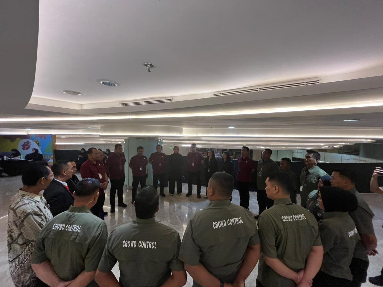 Crowd control team safety briefing before doors open